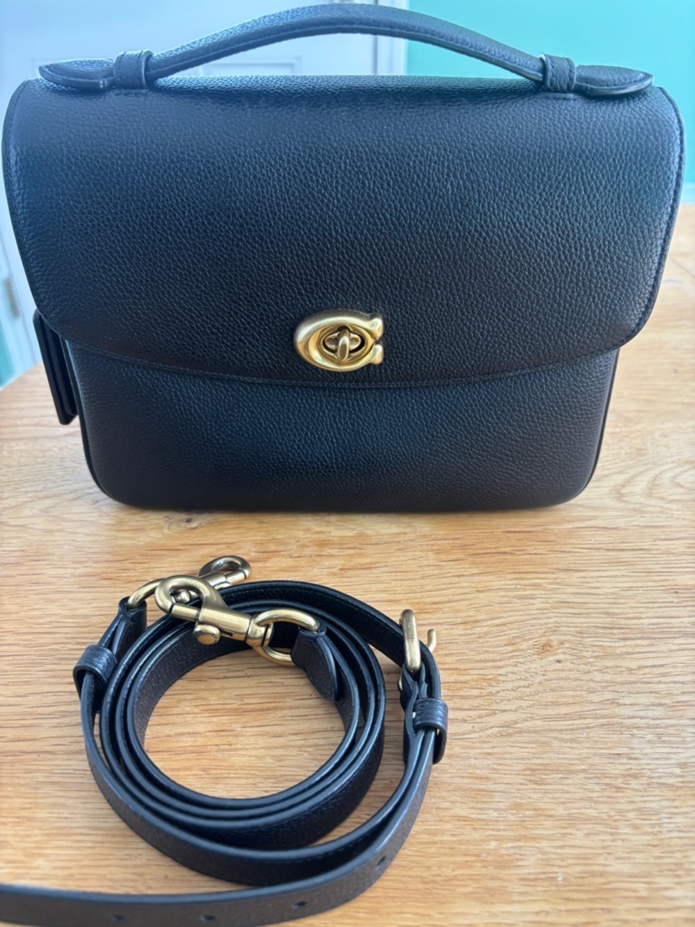 Black Leather Top-Handle Crossbody Bag with Gold Hardware
